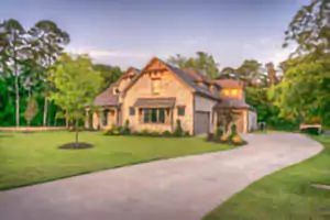 A house with green big trees