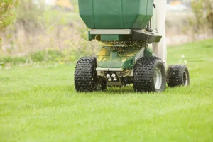 Spreader Applying Fertilizer and Weed Control