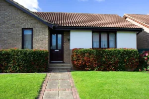 house with beautiful green lawn