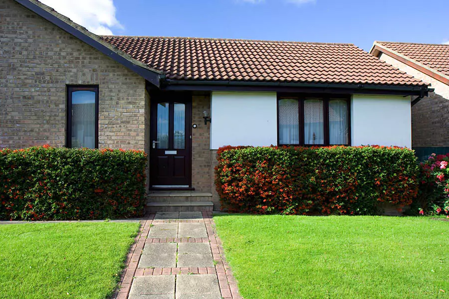 house with beautiful green lawn