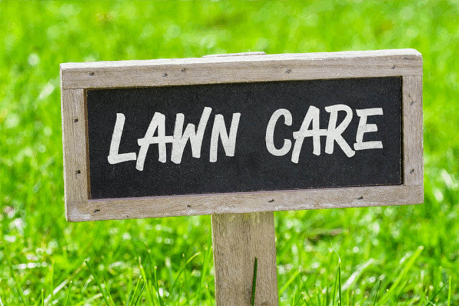 Lawn care signboard in a green lawn