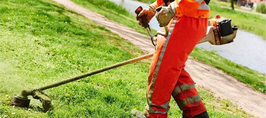 A man doing lawn care mower garden