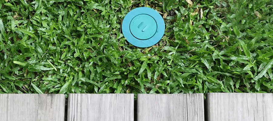 Blue Color lawn manhole in the green grass
